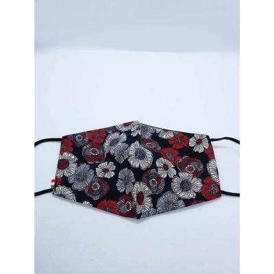 Masque en tissu avec fleurs rouges et noires 